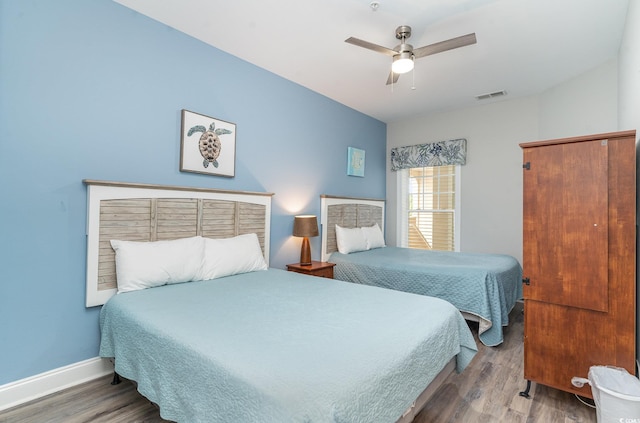 bedroom with wood-type flooring and ceiling fan