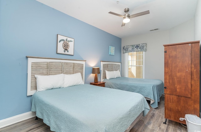 1009 World Tour Blvd Unit 301, Myrtle Beach, SC 29579 - bedroom featuring wood finished floors, baseboards, and a ceiling fan