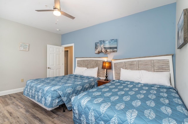 1009 World Tour Blvd Unit 301, Myrtle Beach, SC 29579 - bedroom with wood finished floors, baseboards, and a ceiling fan