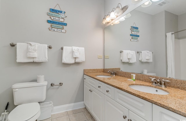 bathroom featuring curtained shower, vanity, toilet, and tile patterned floors