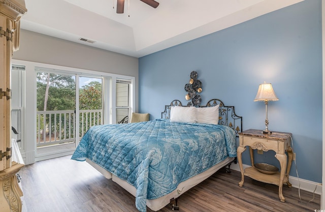 bedroom featuring hardwood / wood-style flooring, ceiling fan, and access to exterior