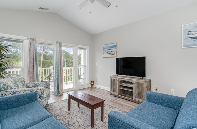 living room featuring light wood-type flooring, lofted ceiling, and ceiling fan