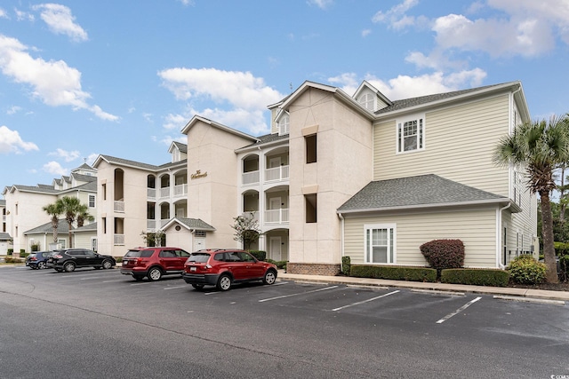1009 World Tour Blvd Unit 301, Myrtle Beach, SC 29579 - view of building exterior featuring uncovered parking