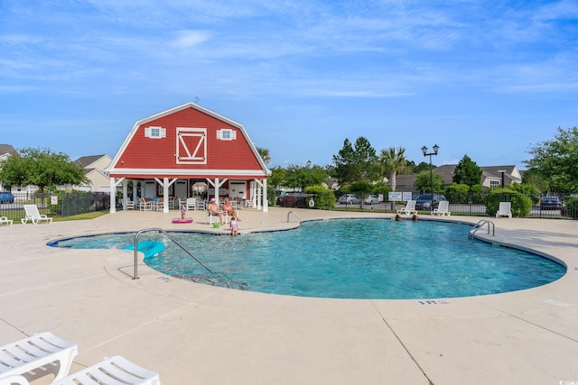 view of swimming pool featuring a patio area