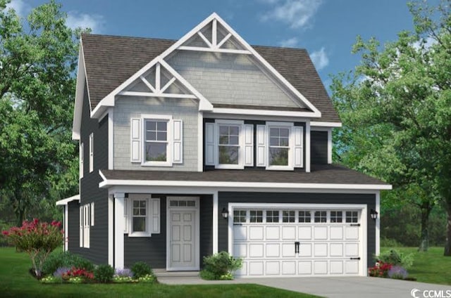 view of front of home featuring a front yard and a garage