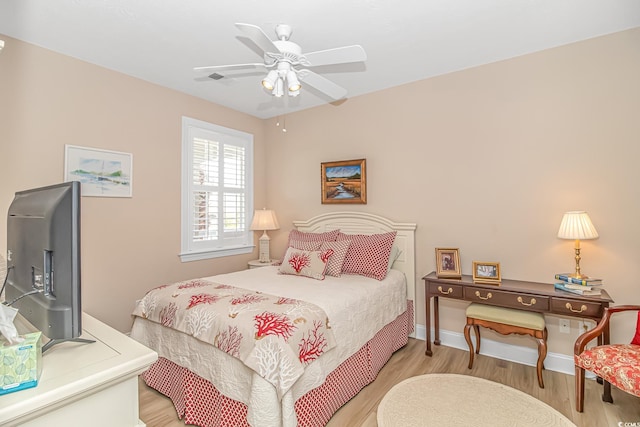 bedroom with light wood-type flooring and ceiling fan