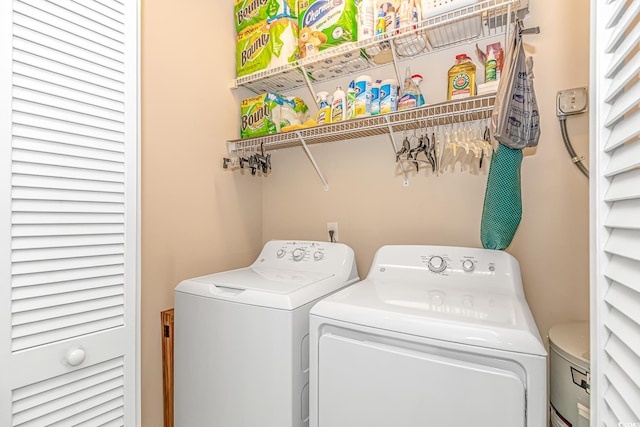 laundry area with independent washer and dryer