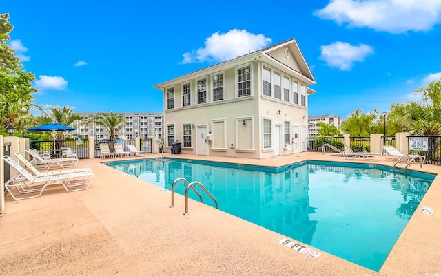 view of swimming pool with a patio