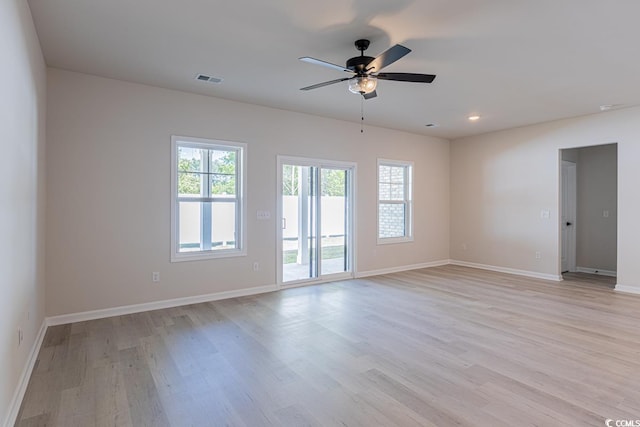 unfurnished room featuring ceiling fan and light hardwood / wood-style floors