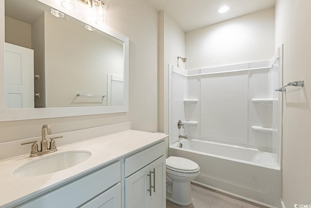 full bathroom featuring shower / bathing tub combination, vanity, toilet, and wood-type flooring