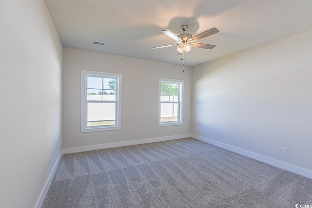 empty room featuring carpet and ceiling fan