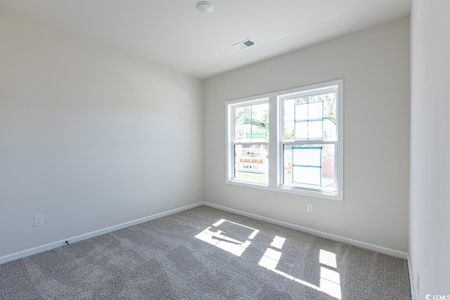 unfurnished room with carpet flooring