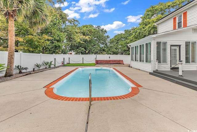 view of pool featuring a patio