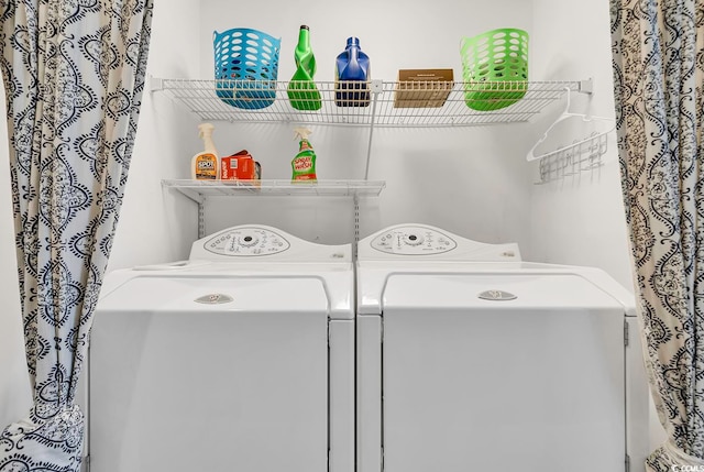 washroom featuring independent washer and dryer