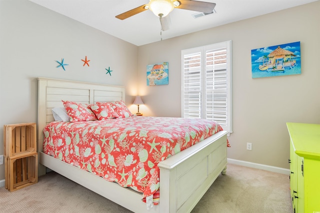 117B Ocean Blvd S, Surfside Beach, SC 29575 - bedroom with light carpet, a ceiling fan, visible vents, and baseboards