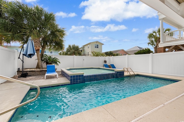 view of pool featuring an in ground hot tub and a patio area