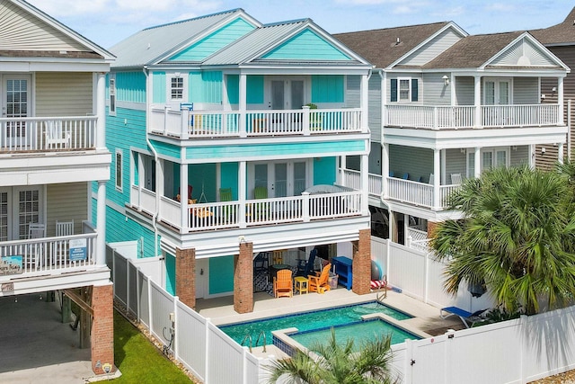 117B Ocean Blvd S, Surfside Beach, SC 29575 - exterior space with a carport, a fenced backyard, and a fenced in pool