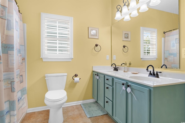 bathroom with vanity, toilet, a shower with shower curtain, and tile patterned floors