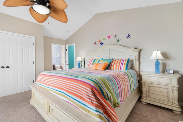 carpeted bedroom featuring ceiling fan, lofted ceiling, and a closet