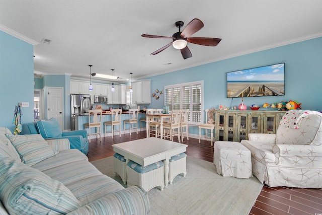 117B Ocean Blvd S, Surfside Beach, SC 29575 - living area with ceiling fan, light wood-style flooring, visible vents, and ornamental molding