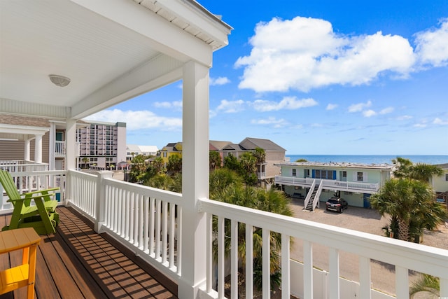 balcony featuring a water view