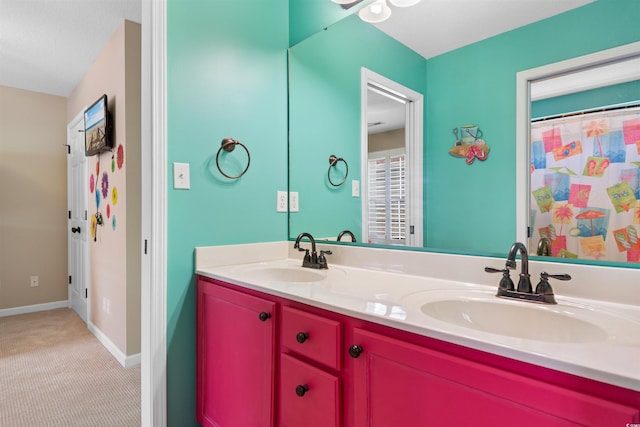 117B Ocean Blvd S, Surfside Beach, SC 29575 - bathroom with baseboards, a sink, and double vanity
