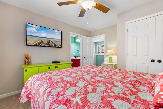 bedroom with ceiling fan, carpet floors, and a closet