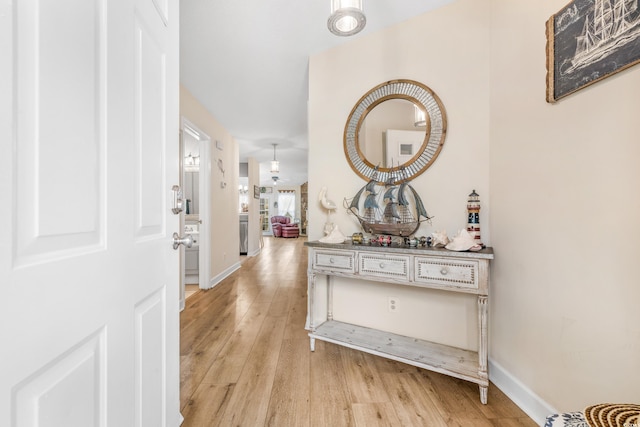 hallway featuring light hardwood / wood-style flooring