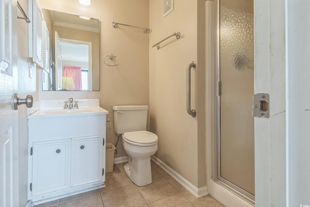 bathroom with vanity, walk in shower, crown molding, tile patterned flooring, and toilet