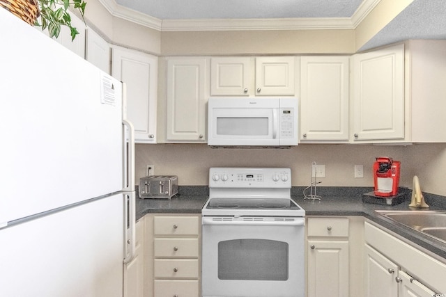 kitchen featuring ornamental molding, white appliances, and white cabinetry