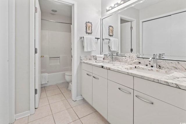 full bathroom featuring tile patterned flooring, vanity,  shower combination, and toilet