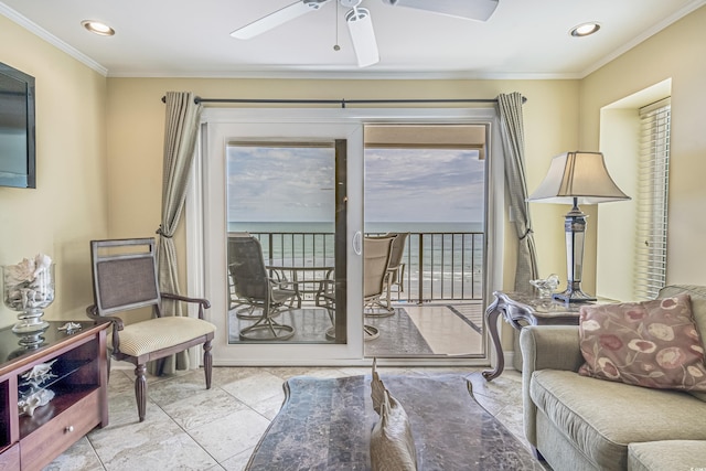 living room featuring ornamental molding and ceiling fan