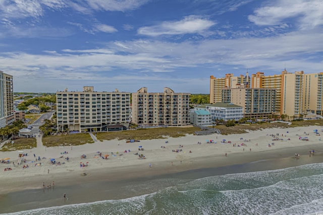 bird's eye view with a view of the beach and a water view