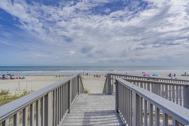 view of home's community with a view of the beach and a water view