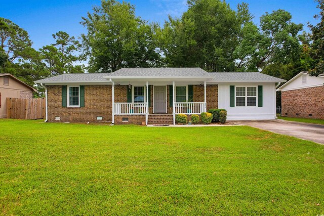 ranch-style home featuring a front yard and a porch