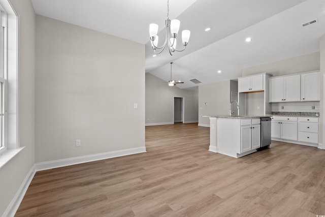 kitchen with light wood-style floors, open floor plan, white cabinets, and ceiling fan with notable chandelier