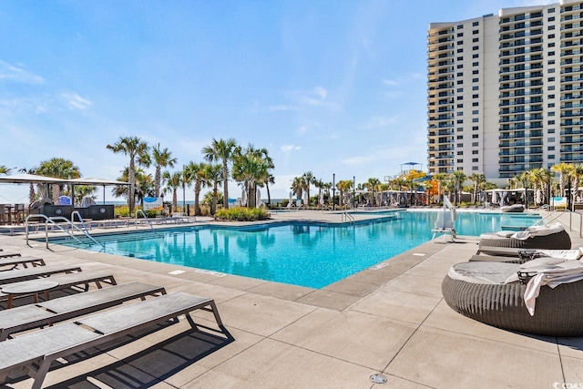 view of pool featuring a patio area