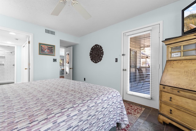 bedroom featuring multiple windows, ceiling fan, and a textured ceiling