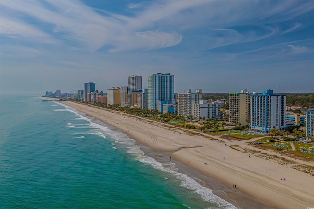 bird's eye view with a water view and a beach view