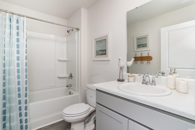 full bathroom featuring hardwood / wood-style flooring, vanity, toilet, and shower / tub combo with curtain