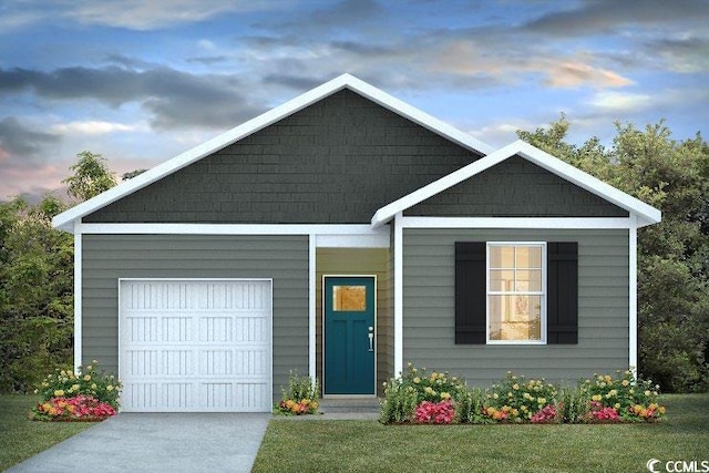 view of front of property with a lawn and a garage