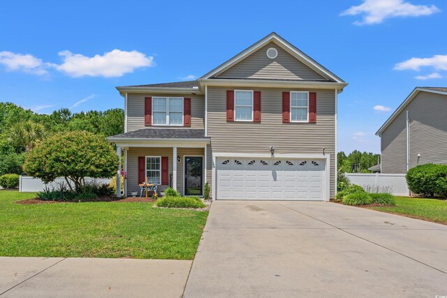 front of property featuring a garage and a front lawn