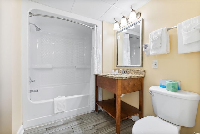 full bathroom featuring sink, shower / tub combo with curtain, and toilet