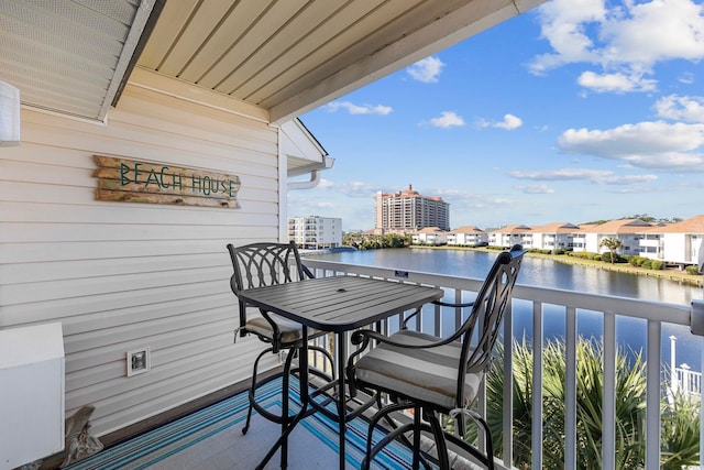 balcony featuring a water view