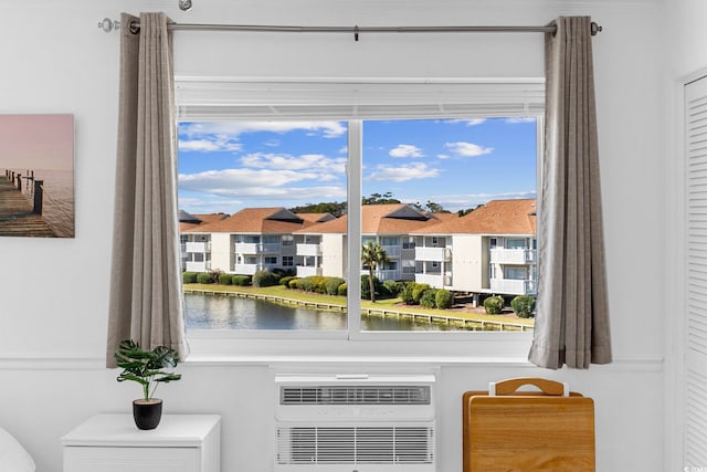 room details featuring cooling unit and a water view