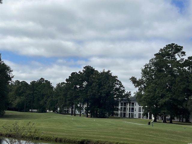 view of home's community featuring a lawn