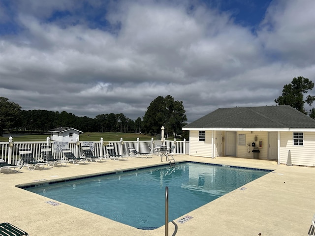 view of swimming pool featuring a patio area