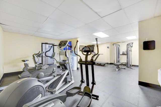 exercise room featuring a paneled ceiling