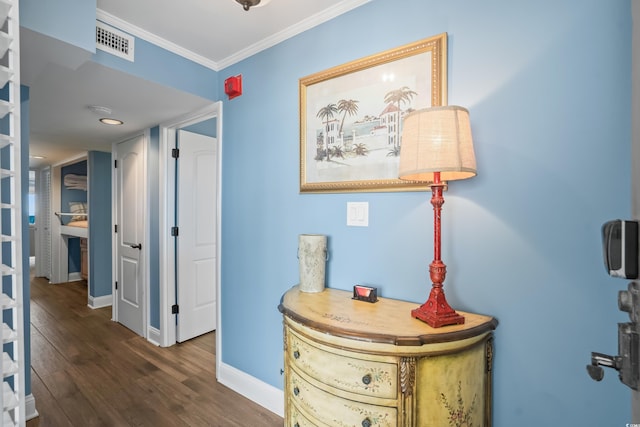 corridor featuring crown molding and dark hardwood / wood-style flooring