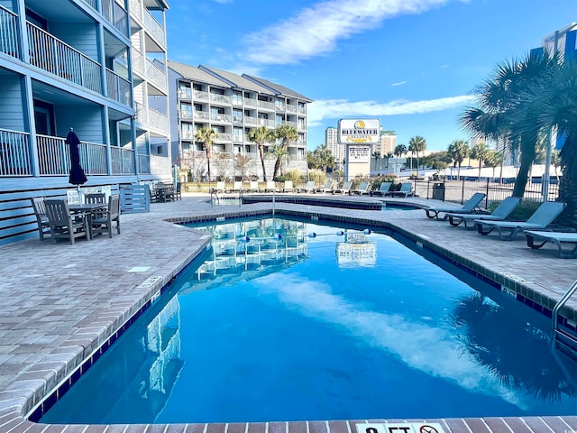 view of pool featuring a patio area